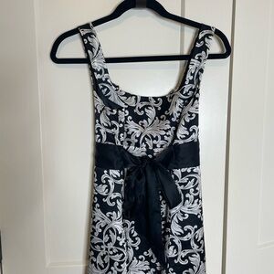 White House Black Market/ Elegant Black and White Floral tunic top (tie in back)